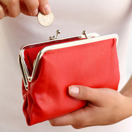 Hands holding red coin purse