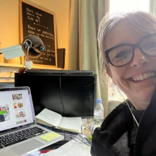 lunch box lady sitting at laptop ready for radio interviews